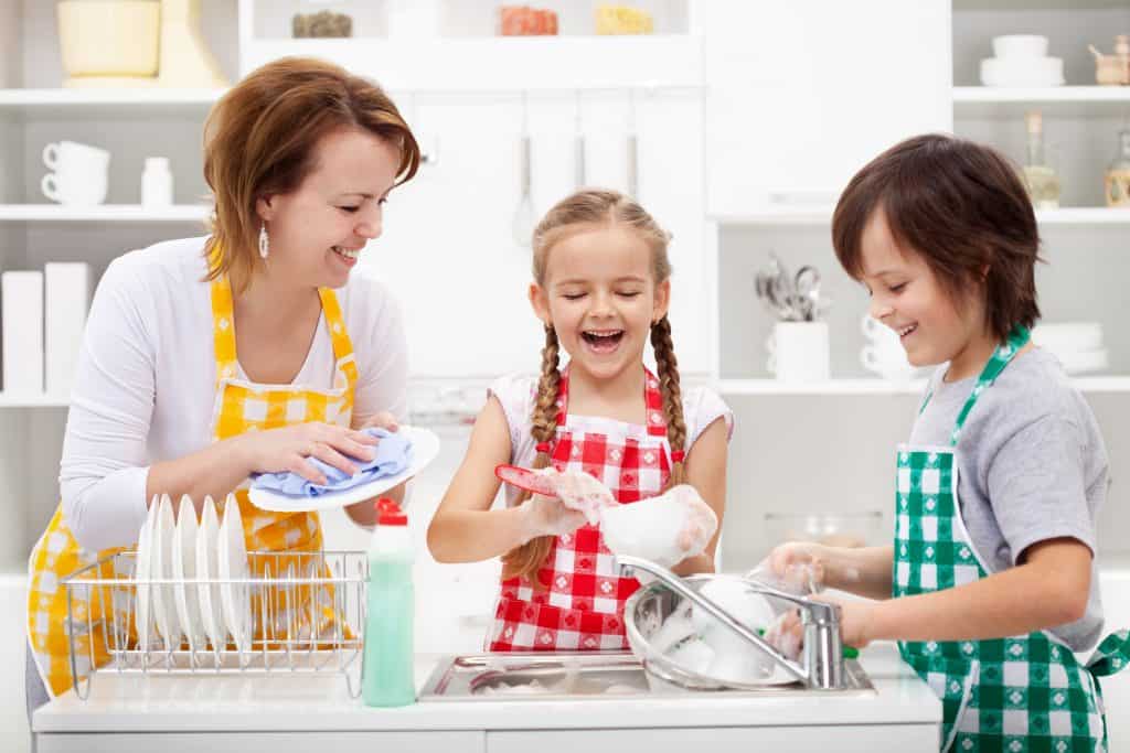 Kids and mother washing the dishes