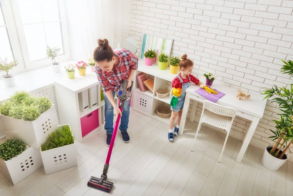 Happy family cleans the room. Mother and daughter do the cleanin